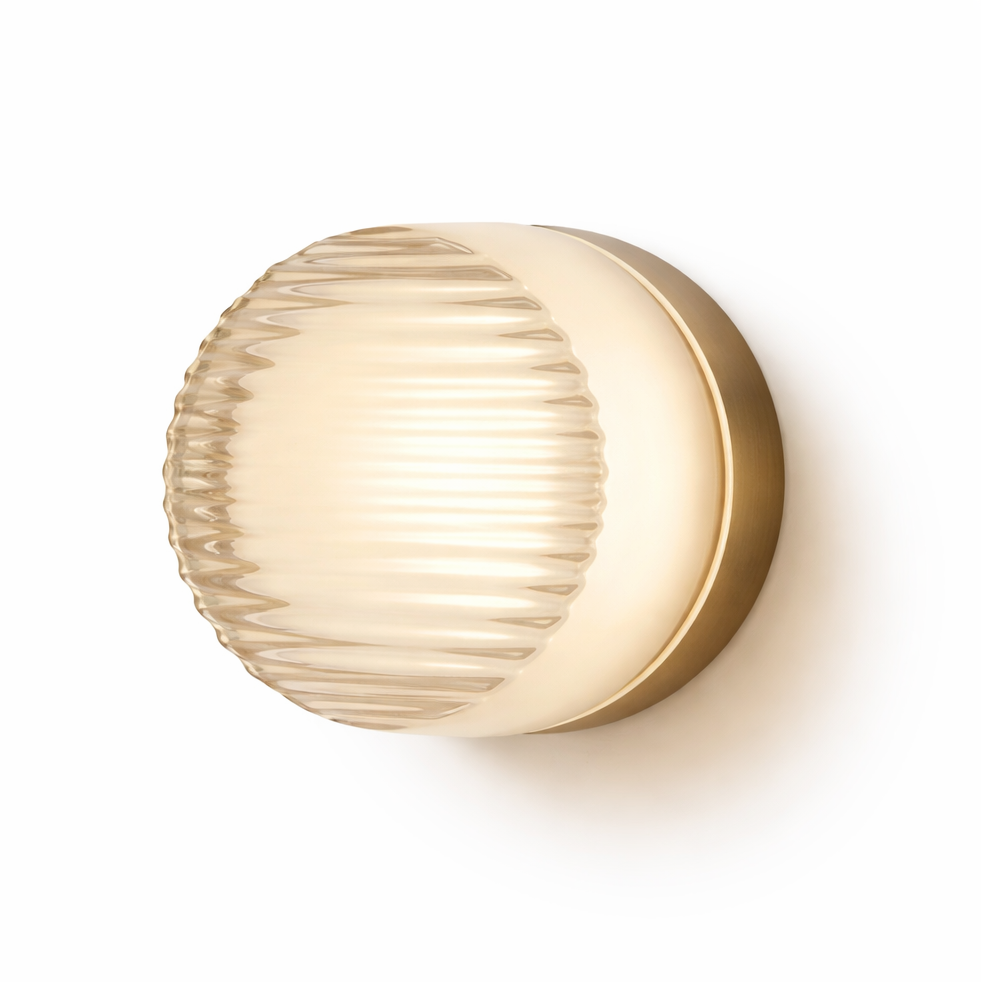 Wall-mounted light fixture with ribbed glass shade on a white background